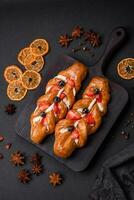 Delicious fresh crispy pastry in the form of a pigtail with strawberries and blueberries photo