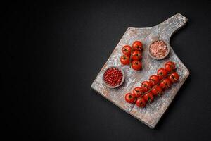 Knife, fork and cutting board, salt, pepper and other ingredients photo