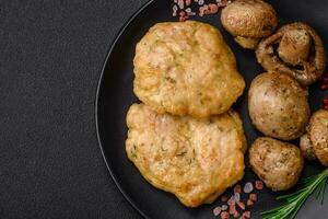 Delicious fried chopped fillet pancakes with spices, salt and herbs photo