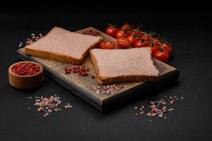 Delicious crispy toast with chicken or goose pate with salt and spices photo