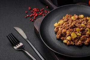 Tasty dish consisting of zucchini, beef meat, mushrooms, onions and garlic photo