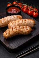 Delicious grilled sausages from chicken or pork meat with salt, spices and herbs photo