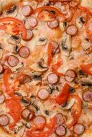 Bavarian pizza with smoked sausages, tomatoes, cheese, salt and spices photo