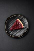 Delicious fragrant sweet pie with cherry berries on a ceramic plate photo