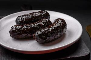 Delicious black blood sausage or black pudding with spices and herbs photo