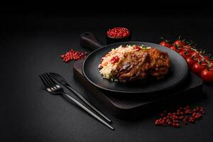 Delicious boiled rice with peppers, peas, asparagus beans and carrots and fried chicken photo