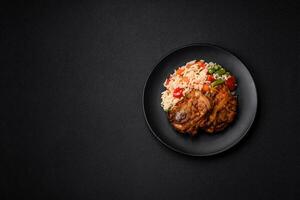 Delicious boiled rice with peppers, peas, asparagus beans and carrots and fried chicken photo