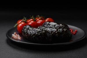 Delicious black blood sausage or black pudding with spices and herbs photo