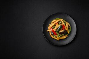 Delicious fried potatoes with bell peppers, asparagus beans, salt and spices photo