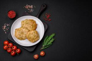 Delicious fried chopped fillet pancakes with spices, salt and herbs photo