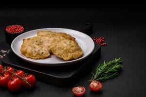 Delicious fried chopped fillet pancakes with spices, salt and herbs photo