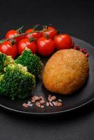 Delicious baked cutlet breaded with spices, salt and herbs photo