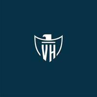 VH initial monogram logo for shield with eagle image vector design