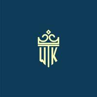 WK initial monogram shield logo design for crown vector image