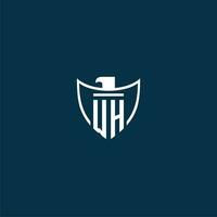 WH initial monogram logo for shield with eagle image vector design