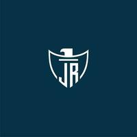 JR initial monogram logo for shield with eagle image vector design