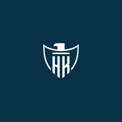 HK initial monogram logo for shield with eagle image vector design