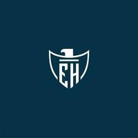 EH initial monogram logo for shield with eagle image vector design