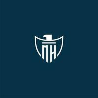 MH initial monogram logo for shield with eagle image vector design