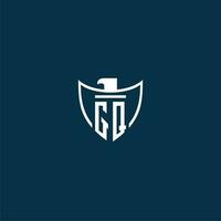 GQ initial monogram logo for shield with eagle image vector design