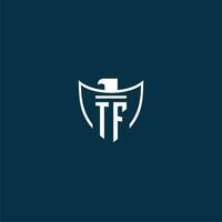 TF initial monogram logo for shield with eagle image vector design