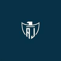 AJ initial monogram logo for shield with eagle image vector design