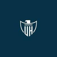 UH initial monogram logo for shield with eagle image vector design