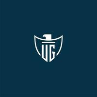 UG initial monogram logo for shield with eagle image vector design