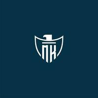 MK initial monogram logo for shield with eagle image vector design