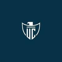 UC initial monogram logo for shield with eagle image vector design