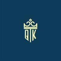 QK initial monogram shield logo design for crown vector image