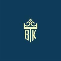 BK initial monogram shield logo design for crown vector image