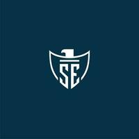 SE initial monogram logo for shield with eagle image vector design