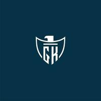 GK initial monogram logo for shield with eagle image vector design