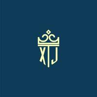 XJ initial monogram shield logo design for crown vector image