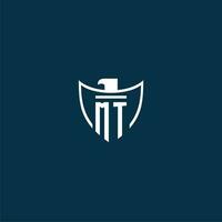MT initial monogram logo for shield with eagle image vector design