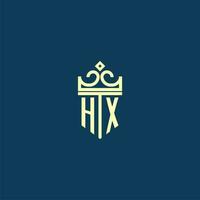 HX initial monogram shield logo design for crown vector image