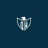 QK initial monogram logo for shield with eagle image vector design