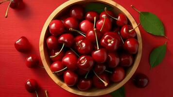 Beat see on arranged sweet cherries in wooden bowl in daylight on ruddy foundation. Video animation