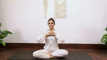 Stock video of a woman performing Hand Stretch Breathing Exercise