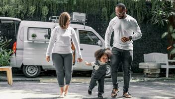 Toddler learn and grow every day with guidance and support of parents as she practice grasping objects and developing walking, running skills. Parents take care of physical, emotional needs of kid. photo