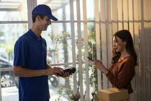 Female vase seller processes orders, including delivery payments, with smartphone and quick response code before sending items to customers. Small business owner work and coordinate with carrier. photo