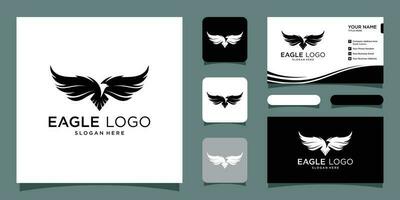 Eagle logo vector symbol, vector illustration with business card design Premium Vector
