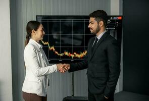 Financial advisors collaborate to assess a company's financial performance using data from its operational activities. Team members work together in a discussions meeting to develop a business plan. photo