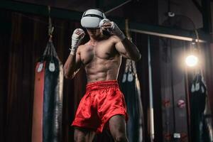 Professional boxer wear virtual reality headsets to engage in immersive boxing workouts simulations while practicing their punching techniques. Live, customized training sessions with boxing coach photo