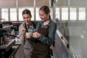 Young adult coffee makers work with skilled baristas to create menus. Using a coffee machine to make hot and cold coffee. Experiment with grinding and blending, including adding milk foam on top. photo