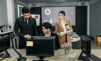 Financial advisors collaborate to assess a company's financial performance using data from its operational activities. Team members work together in a discussions meeting to develop a business plan. photo