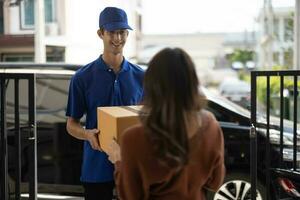 Female vase seller processes orders, including delivery payments, with smartphone and quick response code before sending items to customers. Small business owner work and coordinate with carrier. photo