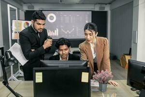 Financial advisors collaborate to assess a company's financial performance using data from its operational activities. Team members work together in a discussions meeting to develop a business plan. photo