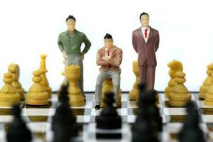 Businessman model on chess board. photo